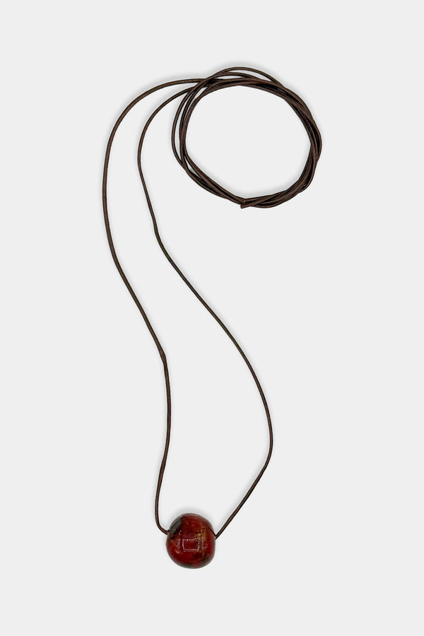 Red Bead with Brown Cord