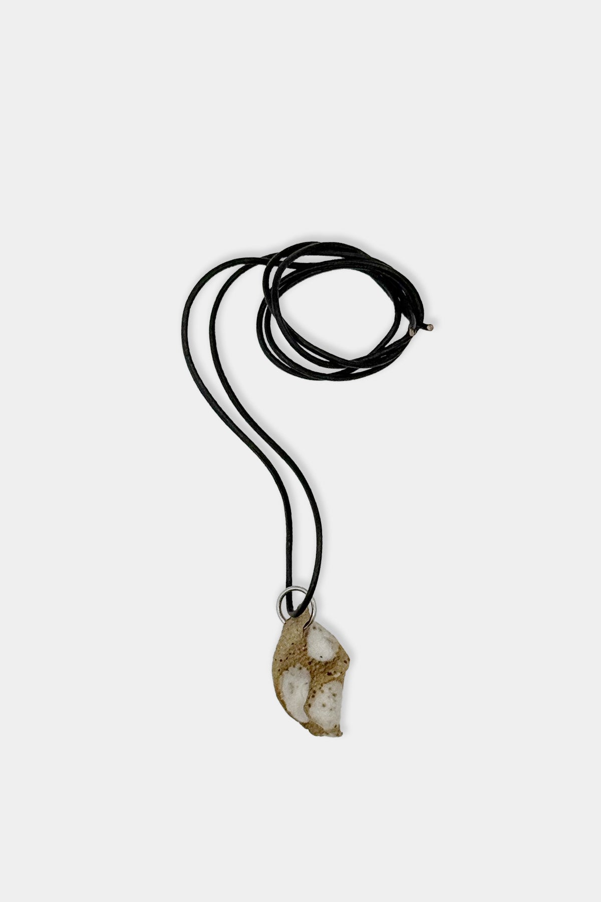 Tan and White Pendant with Black Cord